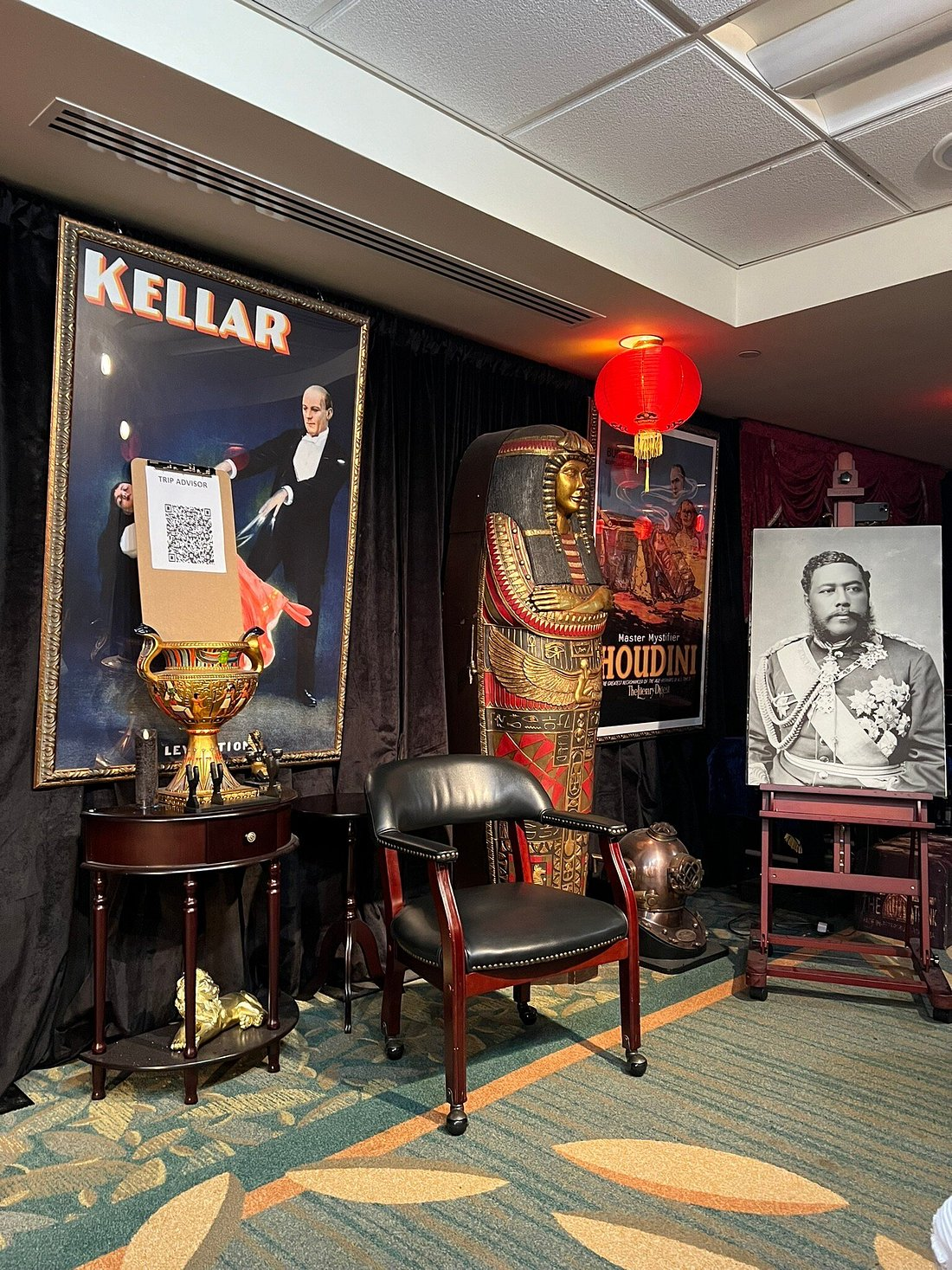 Guest laughing and enjoying a magical performance in a cozy, intimate setting, as part of a comedy and magic show.