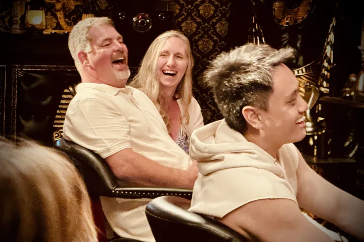 a group of people sitting around each other