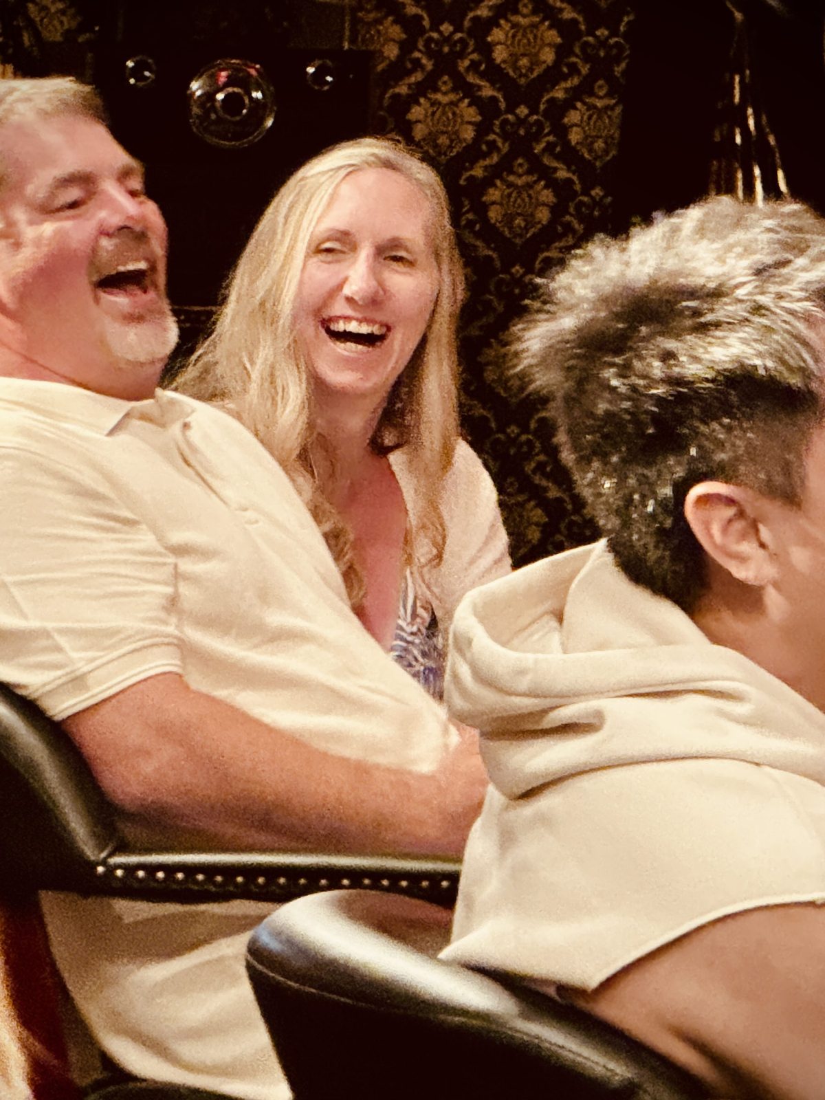 a group of people sitting around each other