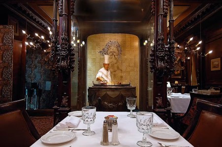 a dining room table in front of a mirror posing for the camera