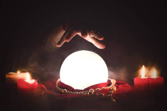 a close up of a fire place sitting in a dark room