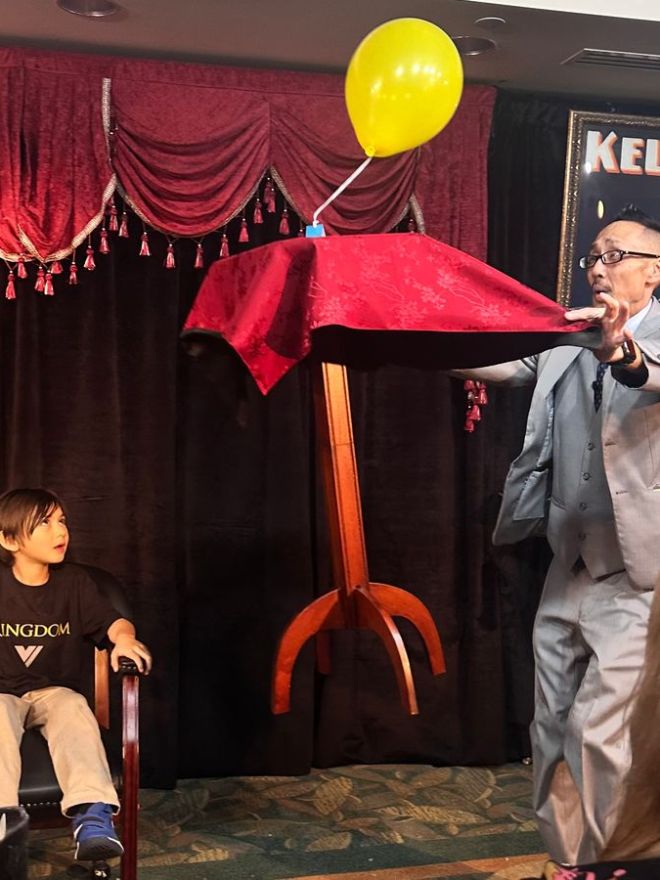 a person standing in front of a curtain